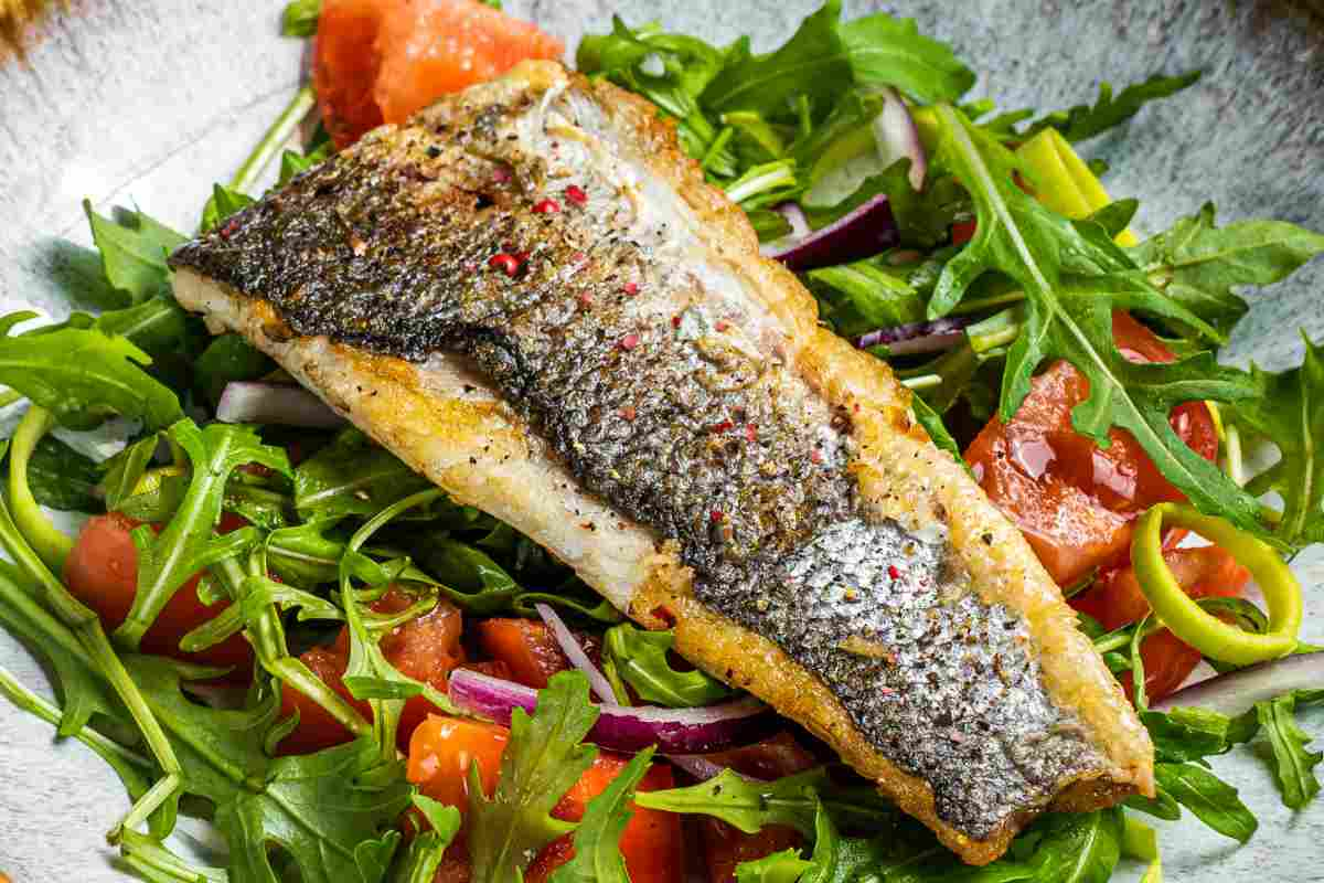 Branzino all'arancia su insalata di rucola