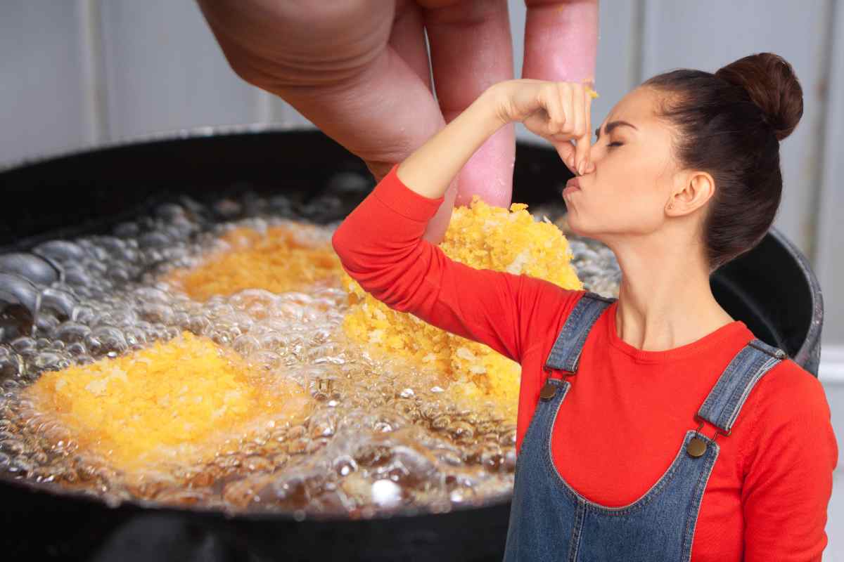 Frittura in corso ed una donna che non sopporta l'odore di fritto